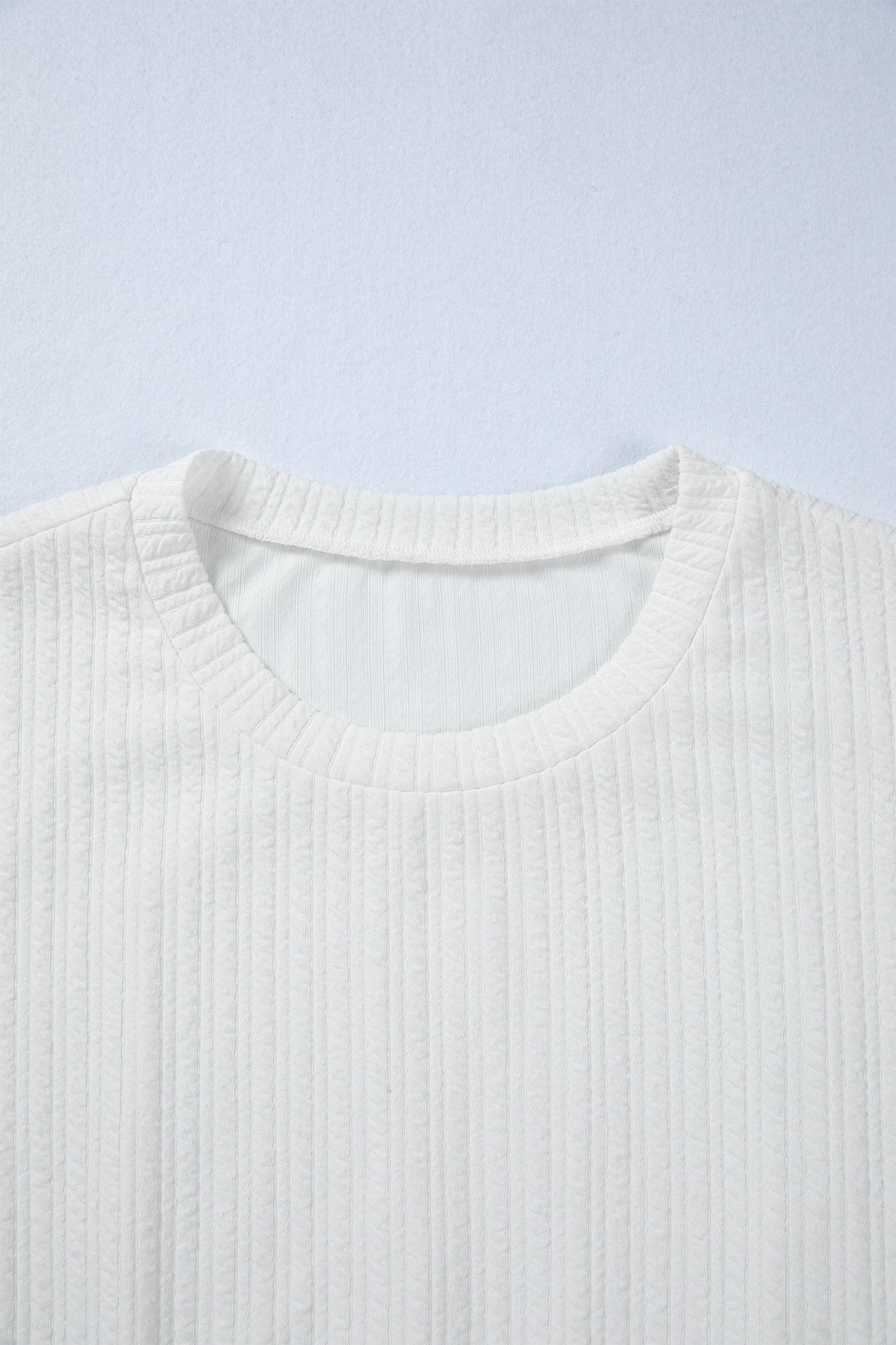 Solid Textured Drop Shoulder Peplum Top