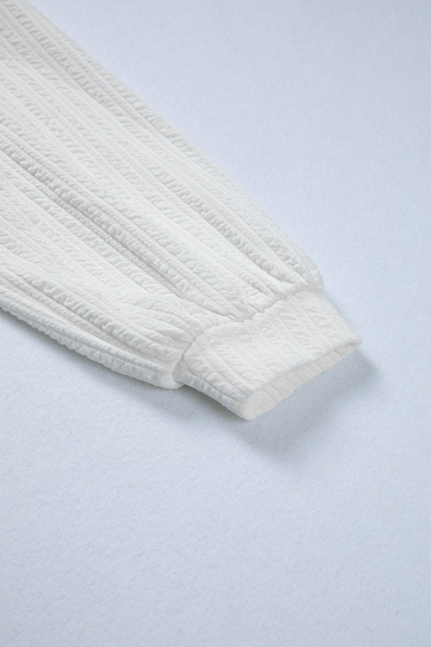 Solid Textured Drop Shoulder Peplum Top