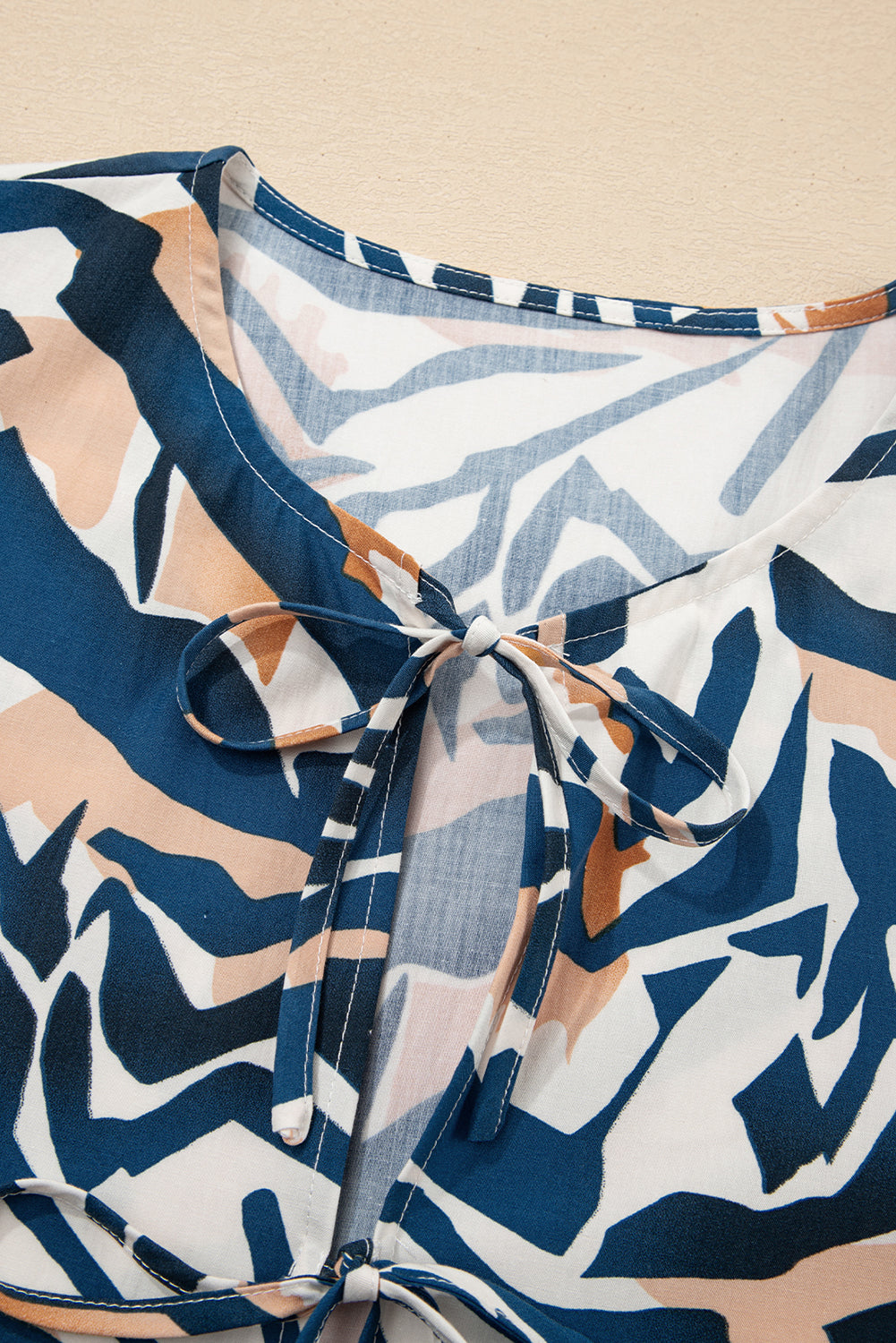 Zebra Tied Front Puff Sleeve Top